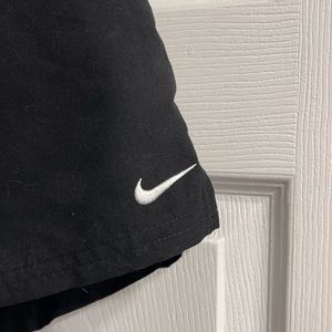 Nike black exercise shorts with pockets and drawstring waist. New with tags.